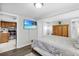 Bedroom with a queen-size bed, wood furniture, and a view of the kitchen at 5080 Seminole Ave, Winter Park, FL 32792