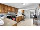 Kitchen features wood cabinets, stainless steel appliances, and tile flooring at 5080 Seminole Ave, Winter Park, FL 32792