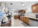 View of kitchen with wood cabinets, stainless steel appliances, and tile floor at 5080 Seminole Ave, Winter Park, FL 32792