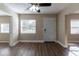 Bright living room with hardwood floors and neutral walls at 1300 Mercy Dr, Orlando, FL 32808