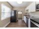 Modern kitchen with stainless steel appliances and granite counters at 1300 Mercy Dr, Orlando, FL 32808