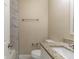 Simple bathroom with granite countertop and marble-look tile at 1300 Mercy Dr, Orlando, FL 32808