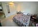 Cozy bedroom with double bed and mirrored closet doors at 6110 Peregrine Ave # E05, Orlando, FL 32819