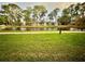 Relaxing waterfront view with lush greenery at 6110 Peregrine Ave # E05, Orlando, FL 32819