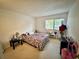 Bright bedroom with a double bed and ample space at 6110 Peregrine Ave # E05, Orlando, FL 32819