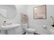 Clean bathroom with pedestal sink, toilet and shower at 2741 Flushing Dr, Apopka, FL 32703