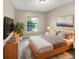 Comfortable bedroom with large window and modern decor at 1048 Universal Rest Pl, Kissimmee, FL 34744