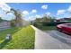Community view showing lush landscaping and parking at 1048 Universal Rest Pl, Kissimmee, FL 34744