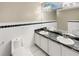Double vanity bathroom with toilet and granite countertop at 1048 Universal Rest Pl, Kissimmee, FL 34744