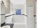 Clean bathroom with a bathtub, shower, and granite vanity at 1048 Universal Rest Pl, Kissimmee, FL 34744