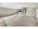 Open living room with carpeted floor and kitchen views at 1048 Universal Rest Pl, Kissimmee, FL 34744