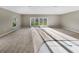 Bright living room with carpeted floor and sliding glass doors at 1048 Universal Rest Pl, Kissimmee, FL 34744