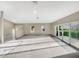 Large living room with carpeted floor and sliding glass doors at 1048 Universal Rest Pl, Kissimmee, FL 34744