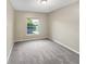 Well-lit bedroom with neutral carpeting at 1048 Universal Rest Pl, Kissimmee, FL 34744
