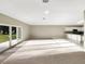Spacious living room with carpeted floor and access to backyard at 1048 Universal Rest Pl, Kissimmee, FL 34744