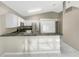 Kitchen boasts granite countertops and white cabinets at 1048 Universal Rest Pl, Kissimmee, FL 34744