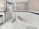 Bathroom with shower, bathtub and double sinks at 1048 Universal Rest Pl, Kissimmee, FL 34744