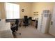 Spacious home office with a large desk, two chairs, and ample storage at 3235 Bellingham Dr, Orlando, FL 32825