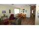 Dining area with wood table and chairs, light walls, and hardwood floors at 3235 Bellingham Dr, Orlando, FL 32825