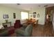 Dining area with wood table and chairs, light walls, and hardwood floors at 3235 Bellingham Dr, Orlando, FL 32825