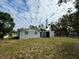 Spacious backyard with a large grassy area at 925 Golden Isle Dr, Mount Dora, FL 32757