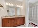 Double vanity bathroom with granite countertops at 15716 Panther Lake Dr, Winter Garden, FL 34787