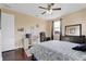 Bright bedroom with a queen-size bed, desk and built-in shelving at 15716 Panther Lake Dr, Winter Garden, FL 34787