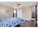 Charming bedroom with a queen bed, dark wood floors, and ceiling fan at 15716 Panther Lake Dr, Winter Garden, FL 34787
