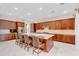 Gourmet kitchen boasting an expansive island and rich wood cabinets at 15716 Panther Lake Dr, Winter Garden, FL 34787