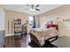 Spacious bedroom with hardwood floors, bookshelf and a comfortable double bed at 15716 Panther Lake Dr, Winter Garden, FL 34787