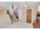 Bright and spacious entryway with a staircase and wood flooring at 15716 Panther Lake Dr, Winter Garden, FL 34787