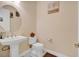 Clean powder room with pedestal sink and toilet at 15716 Panther Lake Dr, Winter Garden, FL 34787