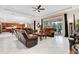 Open living room with adjacent kitchen and access to patio at 15716 Panther Lake Dr, Winter Garden, FL 34787