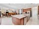 Eat-in kitchen with large island and views into Gathering room at 15716 Panther Lake Dr, Winter Garden, FL 34787