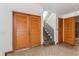 Bright entryway with double doors and staircase at 1000 Winderley Pl # 7, Maitland, FL 32751