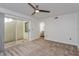 Bedroom with patio access and neutral carpeting at 1000 Winderley Pl # 7, Maitland, FL 32751