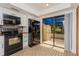Modern kitchen with patio access and breakfast bar at 1000 Winderley Pl # 7, Maitland, FL 32751