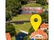 Aerial view showcasing the community tennis courts and property location at 1000 Winderley Pl # 7, Maitland, FL 32751