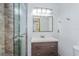 Updated bathroom with gray tile, floating vanity, and glass shower at 1000 Winderley Pl # 7, Maitland, FL 32751