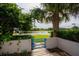Tranquil lake view from the patio, surrounded by lush greenery at 1000 Winderley Pl # 7, Maitland, FL 32751
