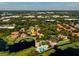 Aerial view showing home's location in a community with pool and lake at 1000 Winderley Pl # 7, Maitland, FL 32751