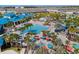 Aerial view of resort pool, clubhouse, and surrounding landscape at 4457 Kaipo Rd, Davenport, FL 33897