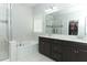 Elegant bathroom with double vanity and soaking tub at 4624 Socrates Way, Sanford, FL 32773