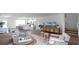 Open concept living room with a view into the kitchen and dining area at 2749 Flushing Dr, Apopka, FL 32703