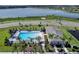 Aerial view of community pool and clubhouse near lake at 2749 Flushing Dr, Apopka, FL 32703