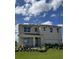 Two-story house with a landscaped lawn at 3722 Bluethread Way, Poinciana, FL 34759