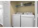Convenient laundry room with washer and dryer in a closet at 2364 Silver Palm Dr, Kissimmee, FL 34747