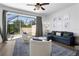 Spacious living room with access to a screened-in patio at 2364 Silver Palm Dr, Kissimmee, FL 34747