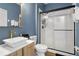 Modern bathroom with a white sink, toilet and a glass shower at 2364 Silver Palm Dr, Kissimmee, FL 34747