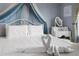 Bright bedroom with a cozy canopy bed and white bedding at 2364 Silver Palm Dr, Kissimmee, FL 34747